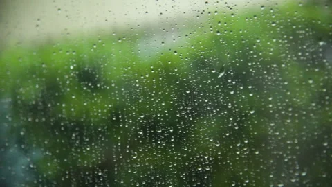 Raindrop on window green background aqua bubble texture. rainfall water surface  動画素材 273437838
