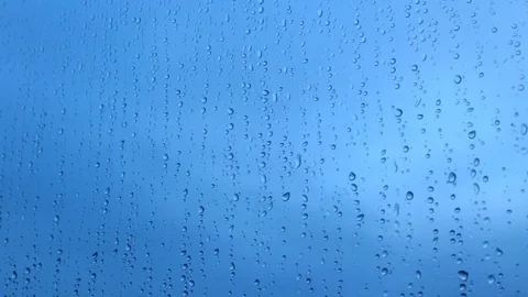 Raindrops against a cloudy sky Stock Footage 82384167