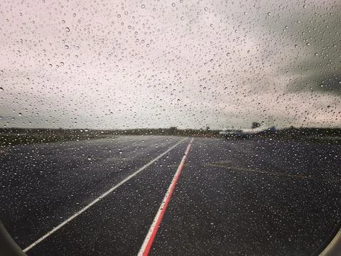 Raindrops on an airplane window Stock Photos