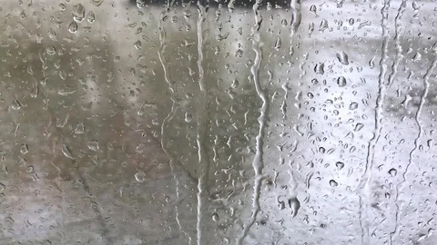 Raindrops and water on window in rainy weather Stock Footage 118526777