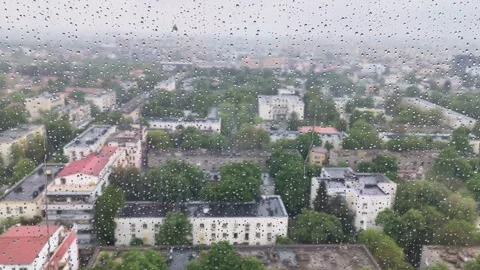 Raindrops are falling down the window of a skyscraper Video stock 240311925