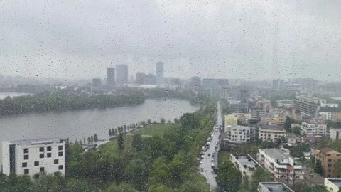 Raindrops are falling down the window of a skyscraper Video stock 240311957
