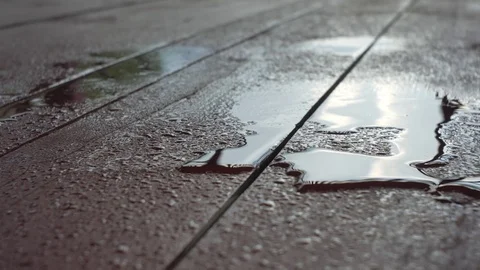 Raindrops are falling on a wooden surface. Stock Footage 78530341