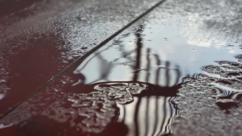 Raindrops are falling on a wooden surface. Stock Footage 78530364