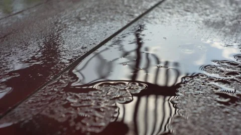 Raindrops are falling on a wooden surface. Stock Footage 78530538
