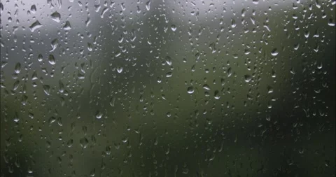 Raindrops are running down the window glass. Bad weather outside. Rain stor.. Stock Footage 336848144
