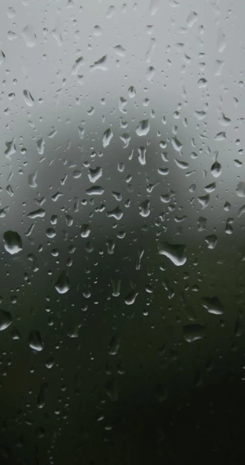Raindrops are running down the window glass. Bad weather outside. Rain stor.. Stock Footage 336848418