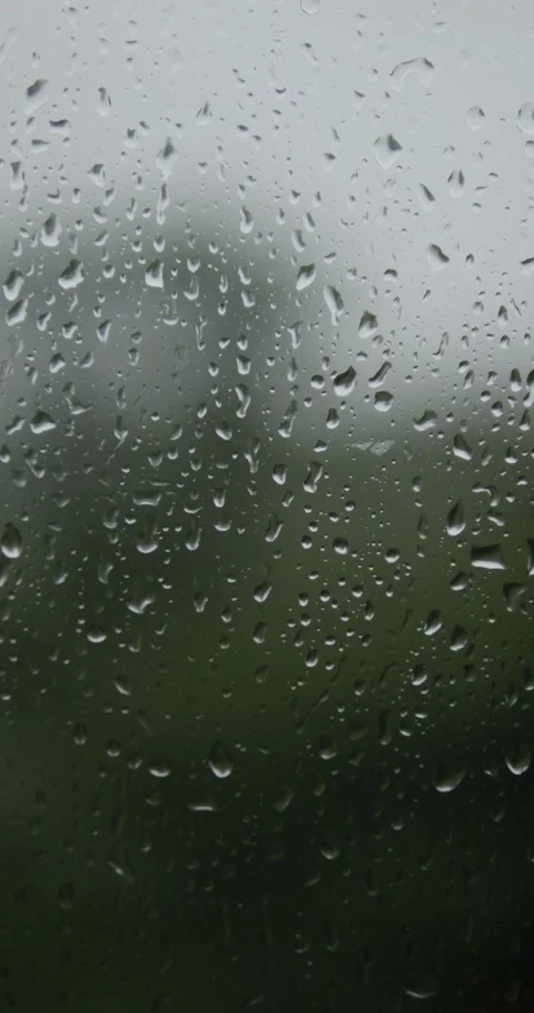 Raindrops are running down the window glass. Bad weather outside. Rain stor.. Stock Footage 336848788