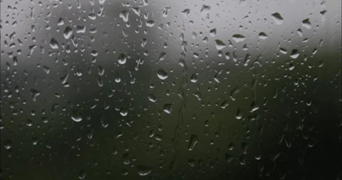 Raindrops are running down the window glass. Bad weather outside. Rain stor.. Stock Footage 336850848