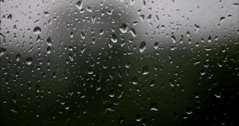 Raindrops are running down the window glass. Bad weather outside. Rain stor.. Stock Footage 337009332