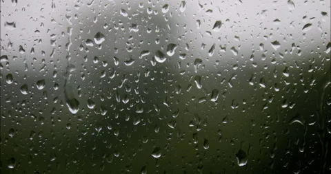 Raindrops are running down the window glass. Bad weather outside. Rain stor.. Stock Footage 337010279