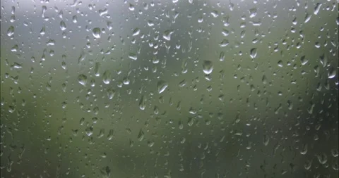 Raindrops are running down the window glass. Bad weather outside. Rain stor.. Stock Footage 337013968
