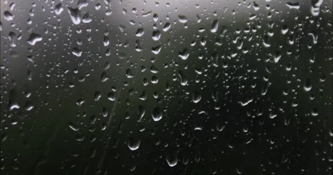 Raindrops are running down the window glass. Bad weather outside. Rain stor.. Stock Footage 337014687