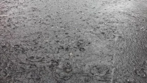 Raindrops on asphalt road Stock Footage 297454746