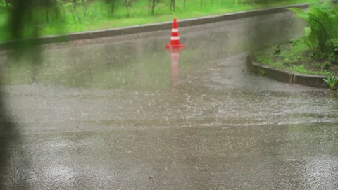 Raindrops on the asphalt, slow motion video Stock-Footage 328299207