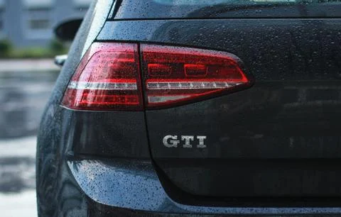 Raindrops on the auto headlight Stock Photos