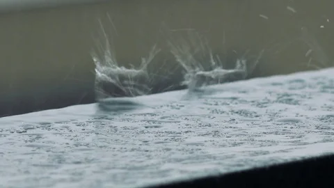 Raindrops beat against a sill - closeup Video stock 82233259