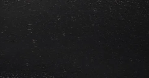 Raindrops on black background Video stock 130482460