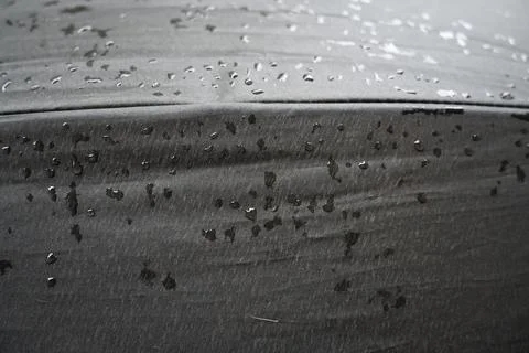 Raindrops on a black umbrella Stock Photos