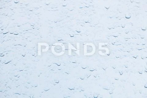 Raindrops on a blue background, detail of wet conditions, rain Stock Photos