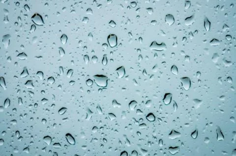 Raindrops on a blue background Stock Photos