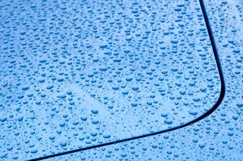 Raindrops on blue Stock Photos