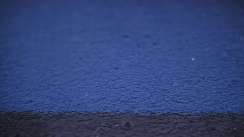 Raindrops in the blue pool Stock Footage 222404054