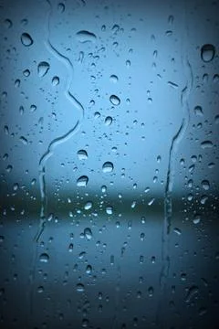 Raindrops on Blue Window Stock Photos