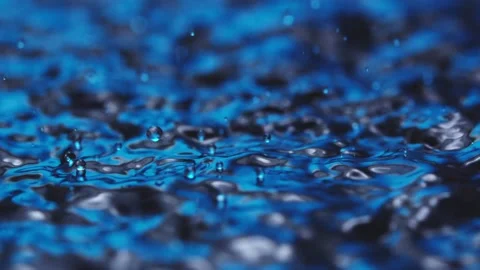 Raindrops bouncing on the water surface Stock Footage 165038868