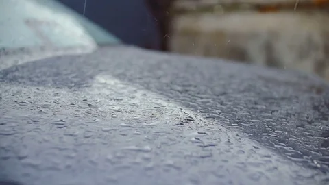 Raindrops break on the surface of the car. Stock Footage 78845898