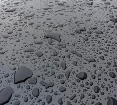 Raindrops on car bumper Stock Photos