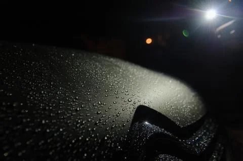Raindrops on the car hood Stock Photos