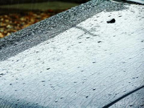 Raindrops on the car Fotos Stock