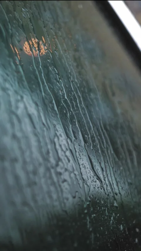 Raindrops on car. rain. raining. raindrops drip and slowly trickling, flowing Stock Footage 316128132