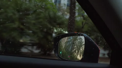 Raindrops on car side mirror Stock Footage 270145981