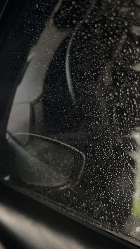Raindrops on Car Side Window During Automatic Car Wash Close-Up 스톡 동영상 340679892
