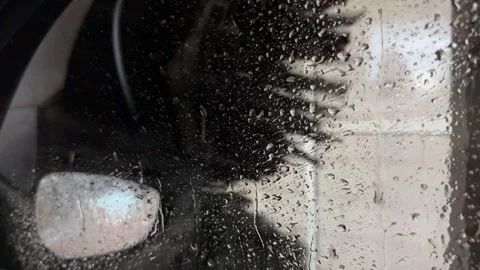 Raindrops on Car Side Window During Automatic Car Wash Close-Up Stock-Footage 340680799