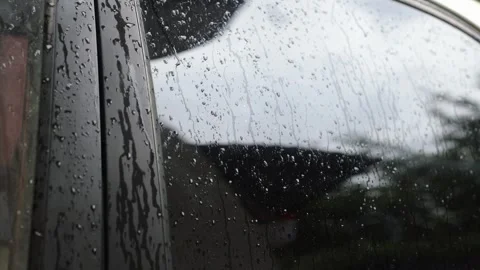 Raindrops on the car window. Bad weather, gloomy and raining Stock Footage 245299145