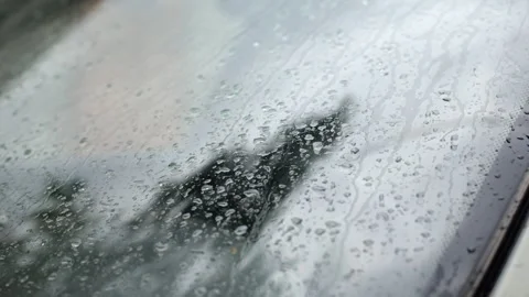 Raindrops on the car window. Bad weather, gloomy and raining Stock Footage 245299190