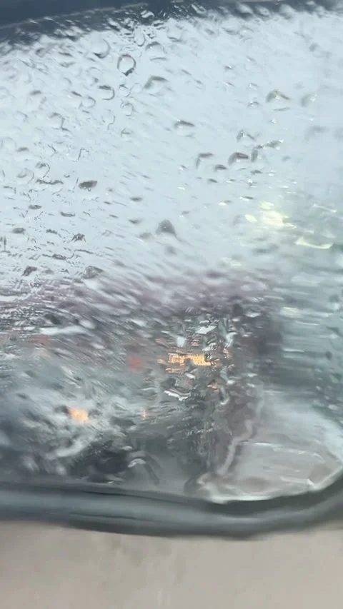 Raindrops On Car Window With Blurred City Traffic Lights Stock Footage 340904434