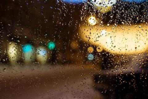 Raindrops on the car window close up Stock Photos