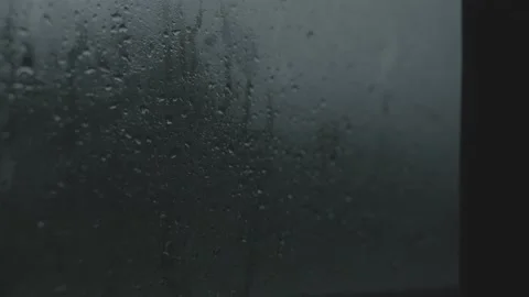 Raindrops on a car window in the evening Stock Footage 201267129