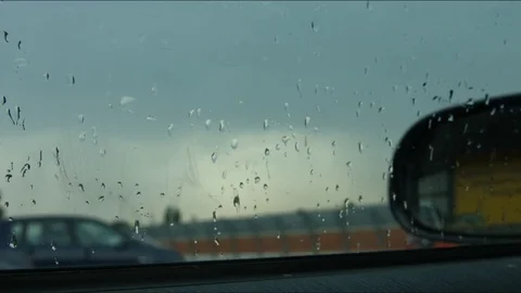 Raindrops on car window Stock Footage 77753621
