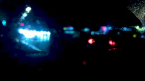 Raindrops on the car window at night. Night highway, cars on the of rain Stock Footage 291450872