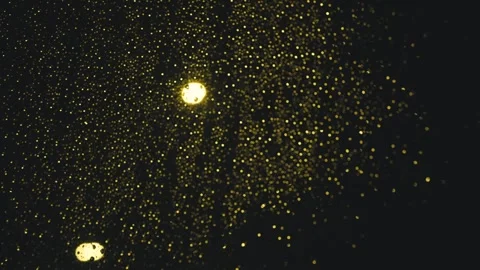 Raindrops on a car window at night with streetlights Video stock 346004591