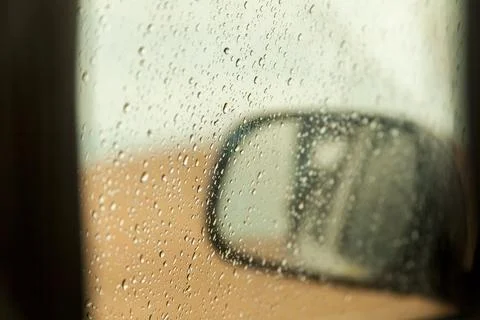 Raindrops on the car window. Rainy day inside the car. bad weather concept. l Stock Photos