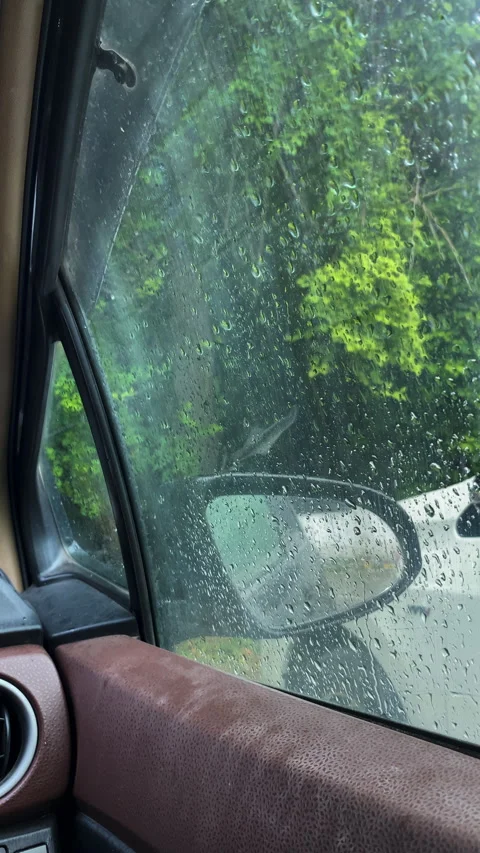 Raindrops on Car Window with Side Mirror Stock-Footage 347216590