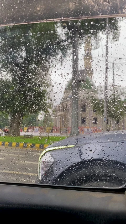 Raindrops on Car Window with Traffic Background Stock Footage 331897404