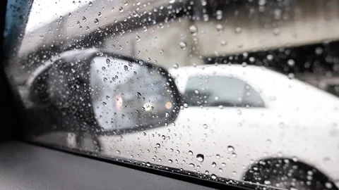 Raindrops on Car Window with Traffic in Bangkok Rain Vídeos de archivo 316462777