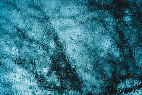 Raindrops on the car window trickling down Stock Photos